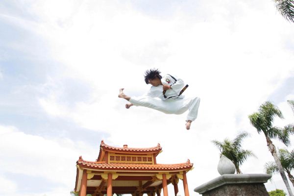 Duc dang taekwondo instructor kim anh jumping front kick